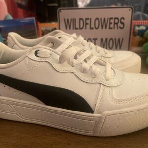 White Platform Puma Sneakers with Black Stripe